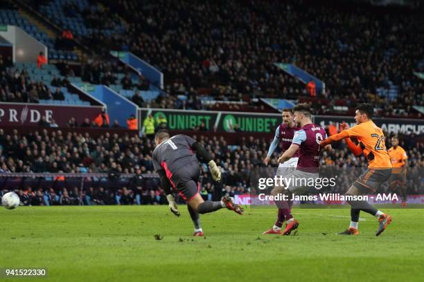 Scott Hogan of Aston Villa scores a goal to make it 3-0 after capitalising on an error by Vito Mannone of Reading during the Sky Bet Championship...