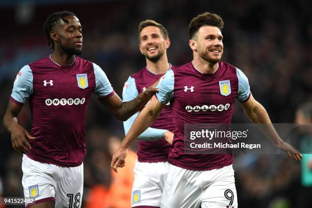 Scott Hogan of Aston Villa celebrates after scoring his sides third goal with Joshua Onomah of Aston Villa during the Sky Bet Championship match...