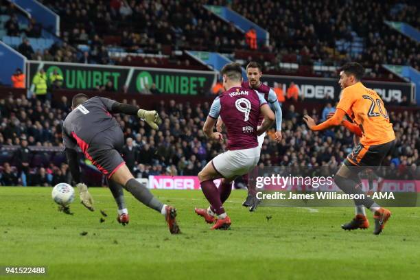 Scott Hogan of Aston Villa scores a goal to make it 3-0 after capitalising on an error by Vito Mannone of Reading during the Sky Bet Championship...