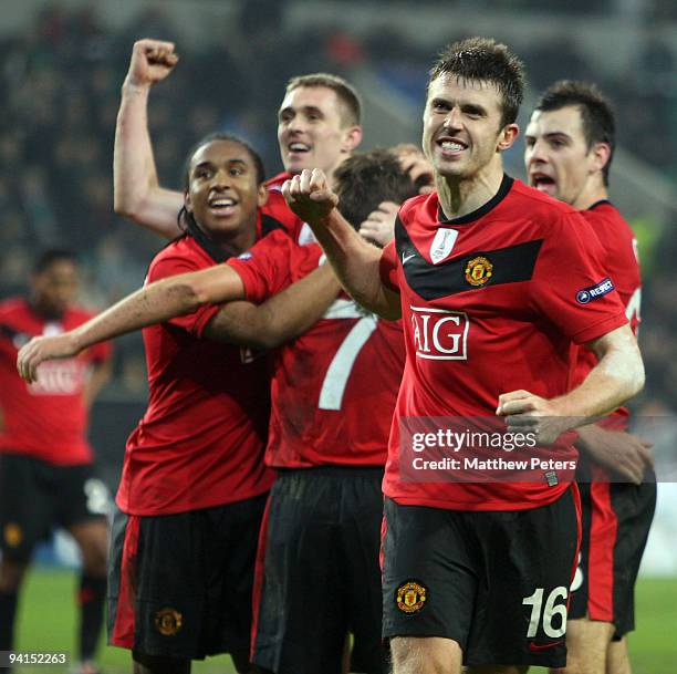 Michael Carrick of Manchester United celebrates Michael Owen scoring their second goal during the UEFA Champions League match between VfL Wolfsburg...