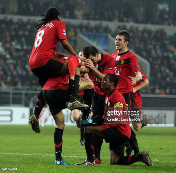 Gabriel Obertan of Manchester celebrates with Patrice Evra, Anderson and other team mates after Michael Owen scored his teams second goal during the...