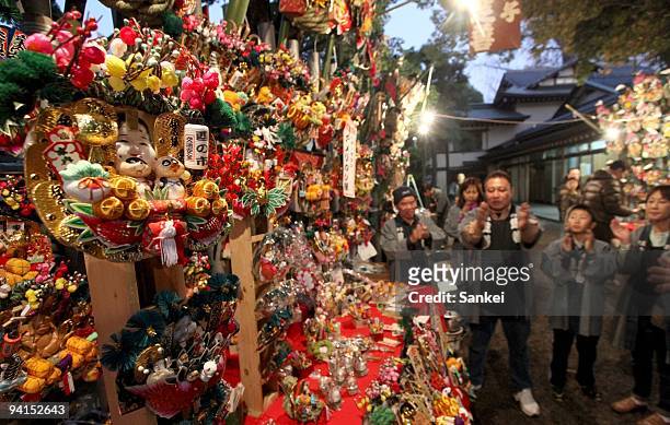 Decorated bamboo rakes, or Kumade are displayed during Oji Kumade Festival at Oji Shrine on December 6, 2009 in Tokyo, Japan. The annual event of...
