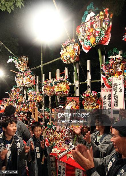 Decorated bamboo rakes, or Kumade are displayed during Oji Kumade Festival at Oji Shrine on December 6, 2009 in Tokyo, Japan. The annual event of...