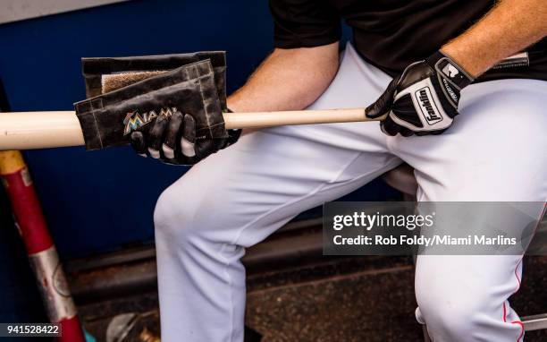 Detailed view a Miami Marlins player preparing a bat with a rosin bag before the game against the Boston Red Sox at Marlins Park on April 3, 2018 in...
