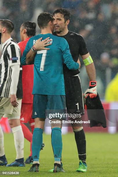 Cristiano Ronaldo of Real Madrid and Gianluigi Buffon of Juventus embrace after the UEFA Champions League Quarter Final Leg One match between...