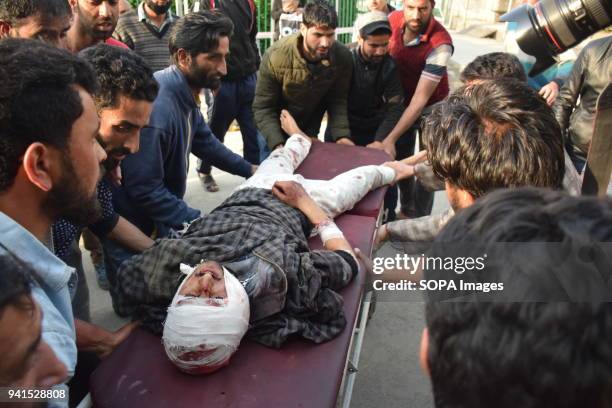 Locals carrying the body of critical injured Amir from Kangan towards hospital In Srinagar. Amir received firearm injury in clashes between...