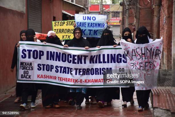 Kashmir Khawateen Markaz Shouts Anti Indian Slogans and holds placards during the protest in srinagar against recent killing in kashmir. Second...