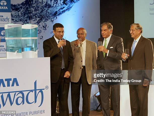 Tata Group Chairman Ratan Tata formally unveiled affordable water purifier device 'Swach'. Also seen is R.Mukundan, MD Tata Chemicals and...