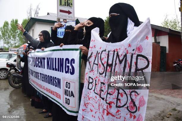 Kashmir Khawateen Markaz Shouts Anti Indian Slogans and holds placards during the protest in srinagar against recent killing in Kashmir. For the...