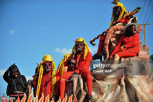 Local people dressed as devils take part in the so called "Convite de Fieros" event, on the eve of the Virgin of the Immaculate Conception...