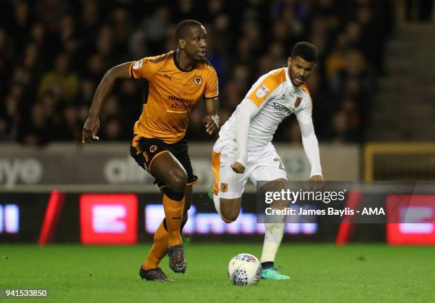 Willy Boly of Wolverhampton Wanderers and Fraizer Campbell of Hull City during the Sky Bet Championship match between Wolverhampton Wanderers and...