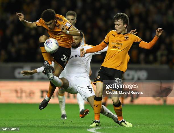 Morgan Gibbs-White of Wolves is challenged by Michael Hector as team mate Oskar Buur Rasmussen looks on during the Sky Bet Championship match between...