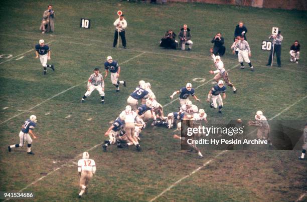 General view as the running back from the Harvard Crimson gets the ball during an NCAA game against the Yale Bulldogs on November 21, 1959 at the...