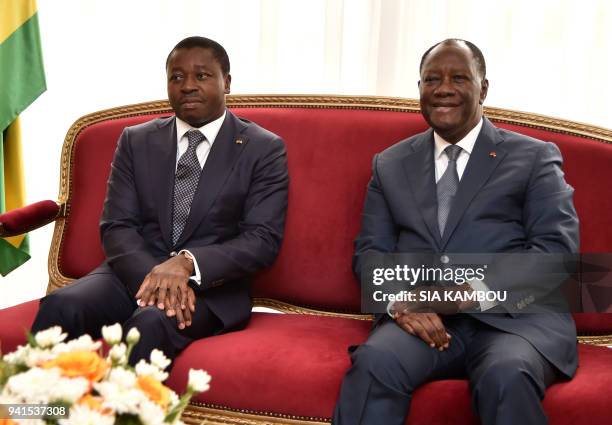 Ivory Coast President Alassane Ouattara meets with Togo's President Faure Gnassingbé at the Presidential Palace in Abidjan on April 3, 2018. / AFP...