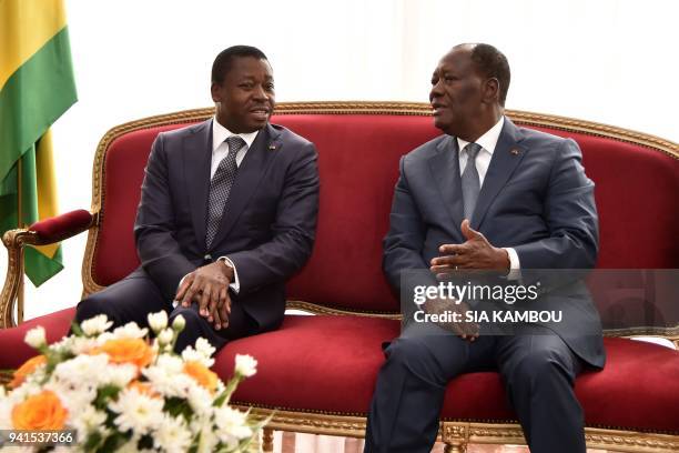 Ivory Coast President Alassane Ouattara meets with Togo's President Faure Gnassingbé at the Presidential Palace in Abidjan on April 3, 2018. / AFP...