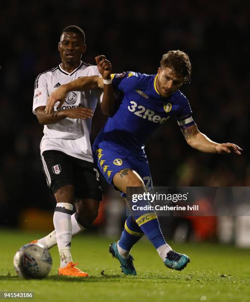 Floyd Ayite of Fulham battles with Gaetano Berardi of Leeds United during the Sky Bet Championship match between Fulham and Leeds United at Craven...