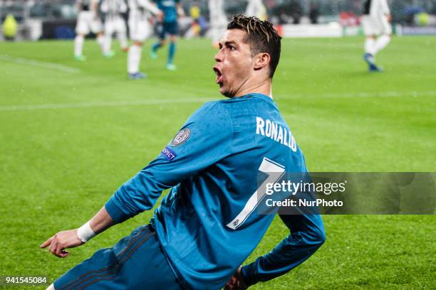 Real Madrid forward Cristiano Ronaldo celebrates after scoring his goal during the Uefa Champions League Round of 16 football match JUVENTUS - REAL...