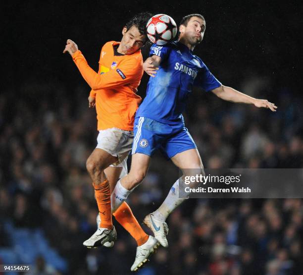 Joe Cole of Chelsea jumps with Nuno Morais of APOEL Nicosia during the UEFA Champions League Group D match between Chelsea and Apoel Nicosia at...