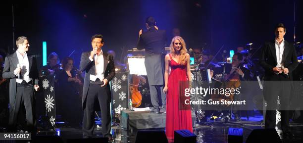 Il Divo and Camilla Kerslake perform on stage at Hammersmith Apollo on December 8, 2009 in London, England.