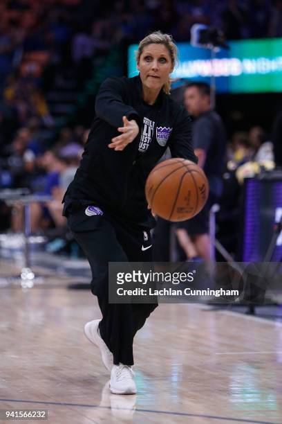 Assistant player development coach of the Sacramento Kings Jenny Boucek puts players through the warm up before their game against the Golden State...