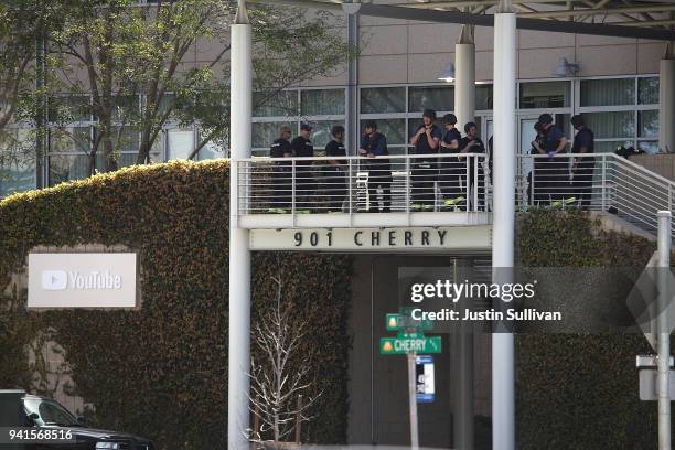 Police officers stand by in front of the YouTube headquarters on April 3, 2018 in San Bruno, California. Police are investigating an active shooter...