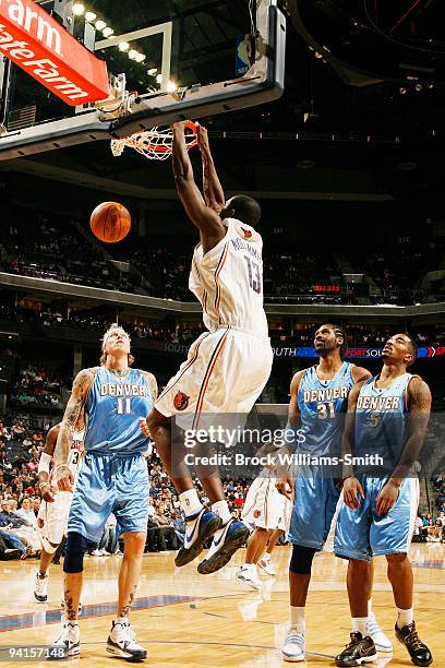 Nazr Mohammed of the Charlotte Bobcats dunks against Chris Andersen of the Denver Nuggets on December 8, 2009 at the Time Warner Cable Arena in...