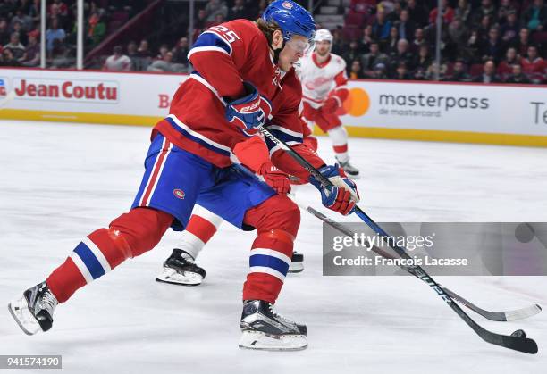 Jacob De La Rose of the Montreal Canadiens controls the puck against the Detroit Red Wings in the NHL game at the Bell Centre on March 26, 2018 in...