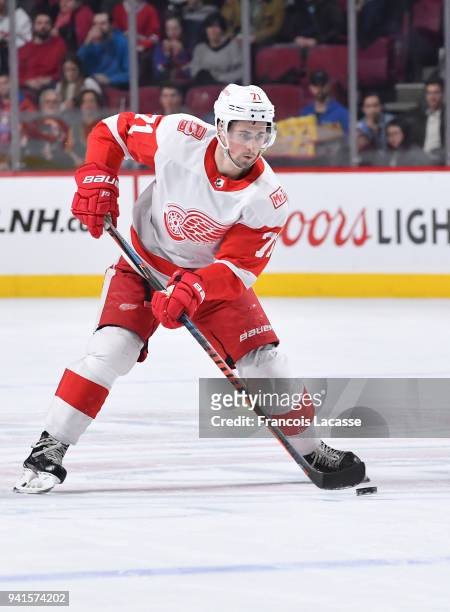 Dylan Larkin of the Detroit Red Wings skates with the puck against the Montreal Canadiens in the NHL game at the Bell Centre on March 26, 2018 in...