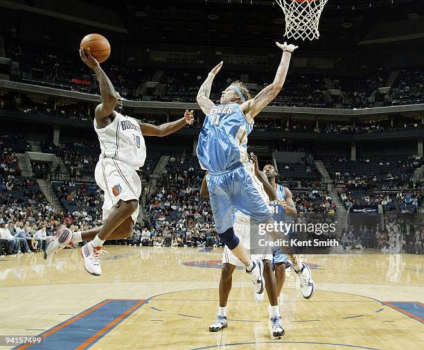 Chris Andersen of the Denver Nuggets defends against Raymond Felton of the Charlotte Bobcats on December 8, 2009 at the Time Warner Cable Arena in...