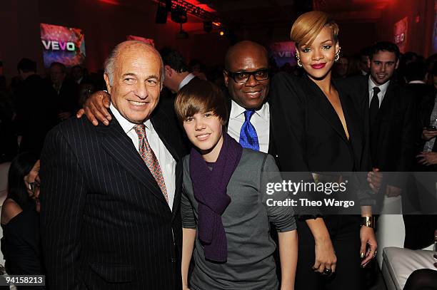 Chairman & CEO of UMG Doug Morris, singer Justin Bieber, Chairman and CEO of Island Def Jam Music Group L.A. Reid and singer Rihanna attend the...