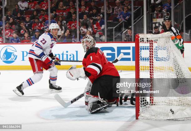 Ryan Spooner of the New York Rangers scores against Keith Kinkaid of the New Jersey Devils at 17:23 of the first period at the Prudential Center on...