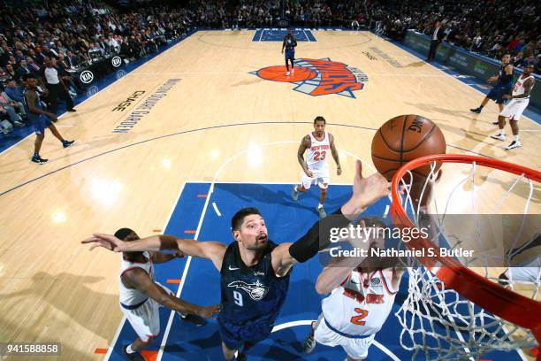 Nikola Vucevic of the Orlando Magic and Luke Kornet of the New York Knicks go to the basket on April 3, 2018 at Madison Square Garden in New York...