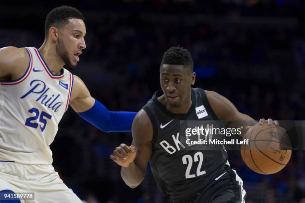 Caris LeVert of the Brooklyn Nets drives to the basket against Ben Simmons of the Philadelphia 76ers in the first quarter at the Wells Fargo Center...