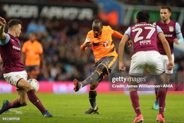 Sone Aluko of Reading has a shot blocked during the Sky Bet Championship match between Aston Villa and Reading at Villa Park on April 2, 2018 in...