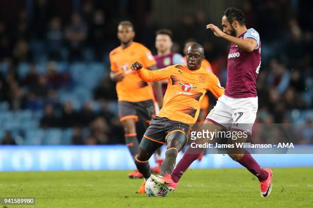 Modou Barrow of Reading and Ahmed Elmohamady of Aston Villa during the Sky Bet Championship match between Aston Villa and Reading at Villa Park on...