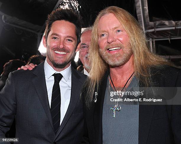 Actor Scott Cooper and musician Greg Allman arrive at the premiere of Fox Searchlight's "Crazy Heat" on December 8, 2009 in Beverly Hills, California.