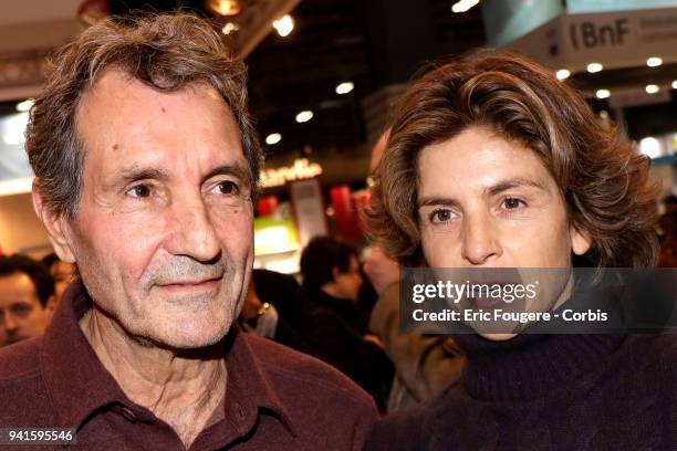 Journalist Jean-Jacques Bourdin and Reporter Anne Nivat poses during Paris Book Fair 2018 at Parc Des Expositions Porte de Versailles, France on .