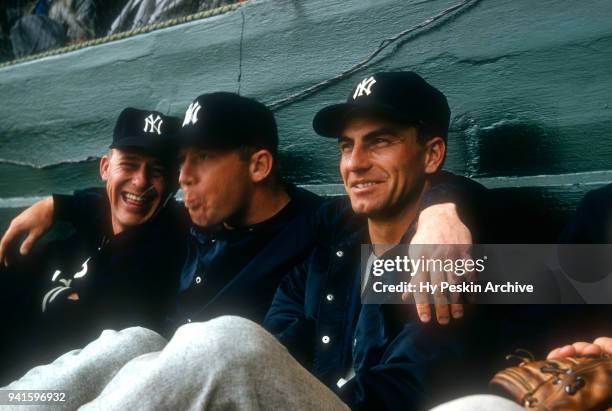 Mickey Mantle of the New York Yankees spits as he sits with a couple of teammates during Spring Training circa March, 1957 in Florida.