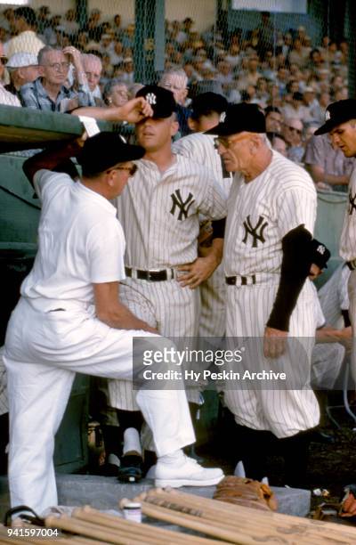 Manager Casey Stengel and Mickey Mantle of the New York Yankees talk to the trainer during Spring Training circa March, 1956 in St. Petersburg,...