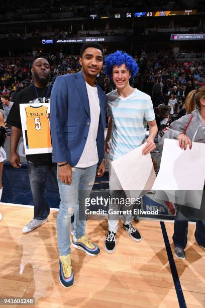 Gary Harris of the Denver Nuggets poses with fan during the game against the Milwaukee Bucks on April 1, 2018 at the Pepsi Center in Denver,...