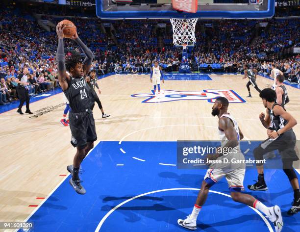 Rondae Hollis-Jefferson of the Brooklyn Nets grabs the rebound against the Philadelphia 76ers at Wells Fargo Center on April 3, 2018 in Philadelphia,...