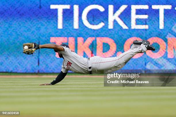 Jackie Bradley Jr. #19 of the Boston Red Sox makes a diving catch during the second inning against the Miami Marlins at Marlins Park on April 3, 2018...