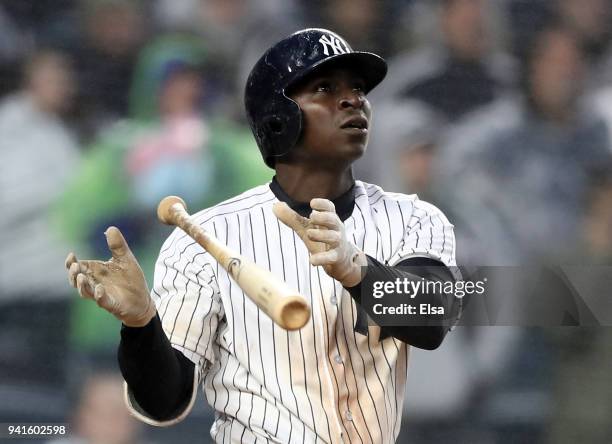 Didi Gregorius of the New York Yankees reacts after he hit a three run home run in the seventh inning against the Tampa Bay Rays during Opening Day...