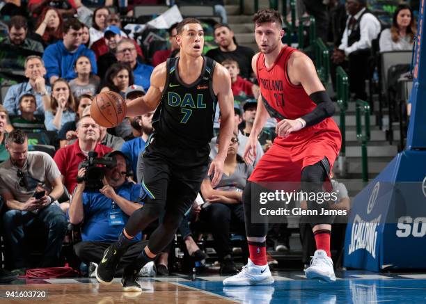 Dwight Powell of the Dallas Mavericks handles the ball against Jusuf Nurkic of the Portland Trail Blazers on April 3, 2018 at the American Airlines...