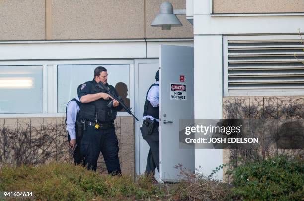 Police search a building at YouTube's corporate headquarters as an active shooter situation was underway in San Bruno, California on April 03, 2018....