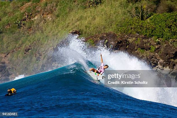 Sally Fitzgibbons of Australia surfs to victory during her round three heat at the Billabong Pro Maui on December 8, 2009 in Honolua Bay, Maui,...