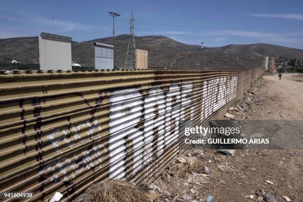 View of the border fence near wall prototypes at the US-Mexico border in Tijuana, northwestern Mexico, on April 3, 2018. President Donald Trump on...