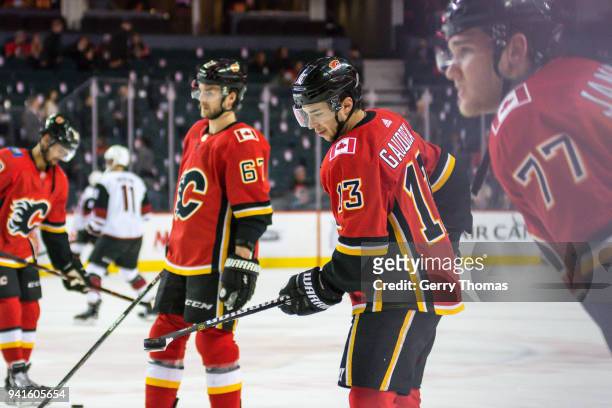 Johnny Gaudreau of the Calgary Flames shows his puck handling skills at warm up in an NHL game on April 3, 2018 at the Scotiabank Saddledome in...