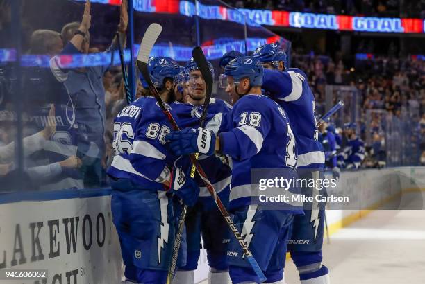 Nikita Kucherov, Brayden Point and Ondrej Palat of the Members of the Tampa Bay Lightning, celebrate a goal against the Boston Bruins during the...