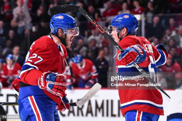 Artturi Lehkonen of the Montreal Canadiens celebrates his second period goal with teammate Alex Galchenyuk against the Winnipeg Jets during the NHL...